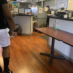 a man in a black shirt and white shorts