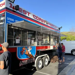 people ordering food from a food truck