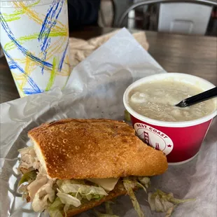 4 inch small turkey sandwich with clam chowder and soda