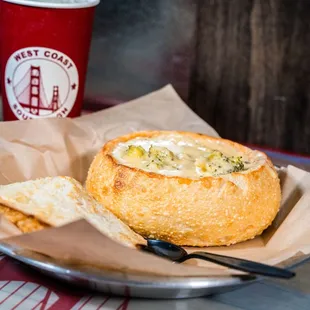 Broccoli and Cheddar soup in a bread bowl