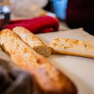 two sourdoughs on a cutting board