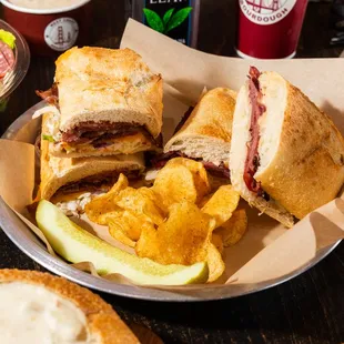 a plate of sandwiches and chips