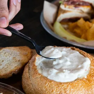 a person scooping sourdou into a sourdout