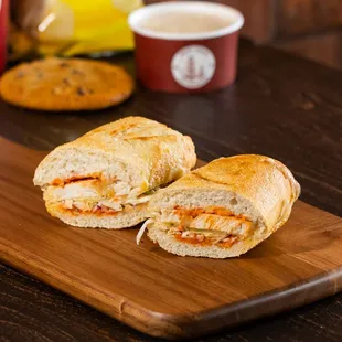 two sandwiches on a cutting board