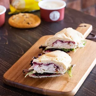 two sandwiches on a cutting board
