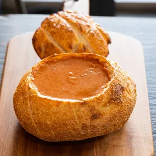 two sourdoughs on a cutting board