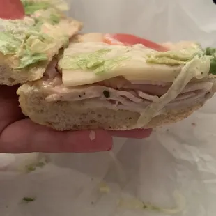 A sad and skimpy Turkey sandwich. &amp; even worse: the ends of a tomato.
