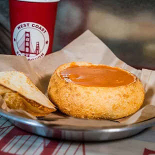 Tomato Bisque soup in a bread bowl.