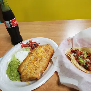 Fajita beef chimichanga with a el pastor taco and a coke