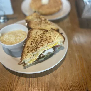 Fried Egg Sandwich no bacon/added fried chicken with roasted garlic grits