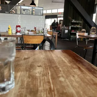 a glass of water on a wooden table