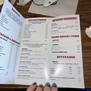 a person holding a menu