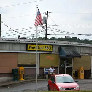 a car parked in front of a restaurant