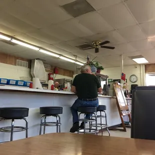 a man sitting at a counter