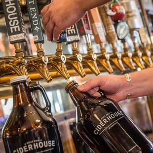 a person filling a beer