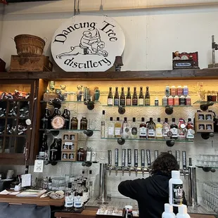 a woman behind the bar