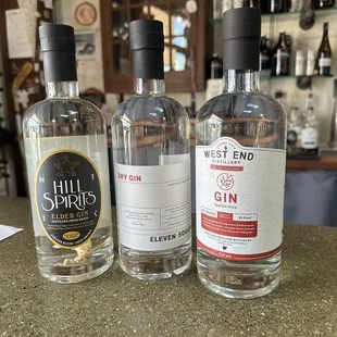 three bottles of gin