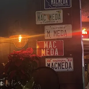 a bar with a lot of signs on the wall