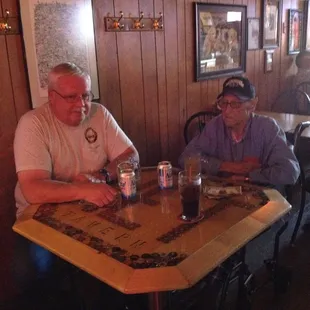 two men sitting at a table