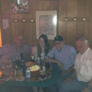 a group of people sitting around a table