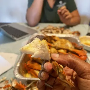 a person holding a piece of food