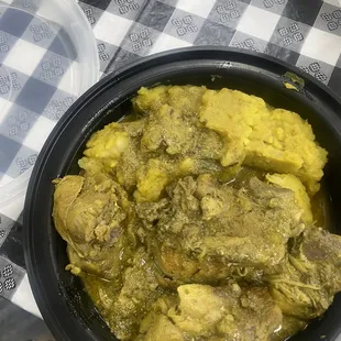 a bowl of stew with potatoes and meat
