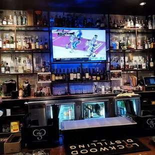 a bar with a large screen tv