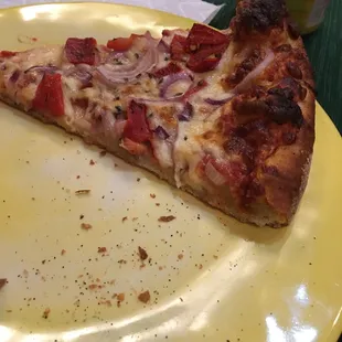 a slice of pizza on a yellow plate