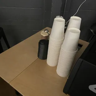 a stack of cups on a table