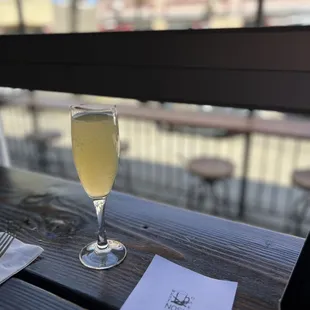 a glass of wine on a table