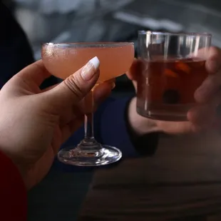 a person holding a drink