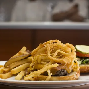 West Burger topped with cheddar, bacon, and crispy hand cut onion strings.