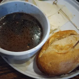 The French dip sandwich and au jus.