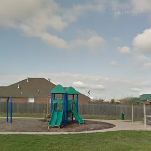 Swings, jungle gym, covered picnic tables.