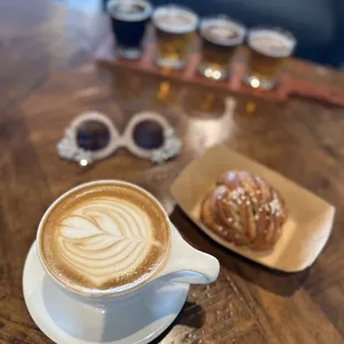 a cup of cappuccino and a plate of croissants