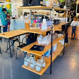 All their merch + coffee to buy on the back wall.