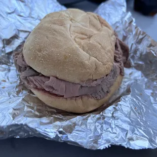 a sandwich wrapped in tin foil