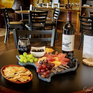 a table with wine and snacks