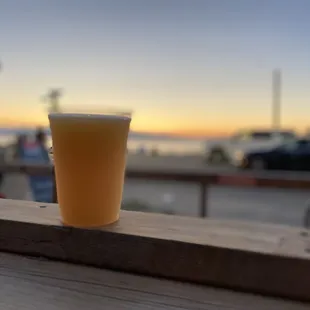 a glass of beer on a table