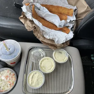 My order of 2 pieces of cod, slaw and 3 tartars.