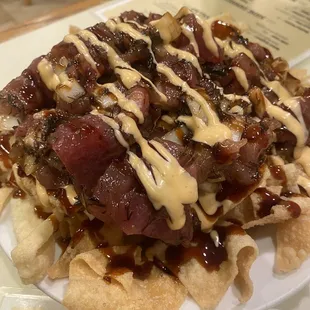 Poke nachos was good , great service , and fun karaoke ! I dig this place.