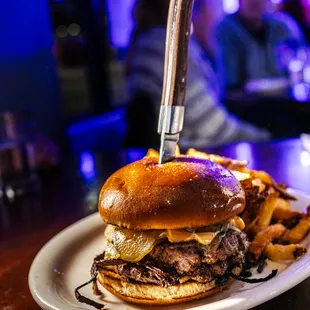 a steak sandwich and fries