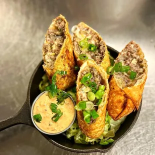 a cast iron skillet filled with meat and vegetables