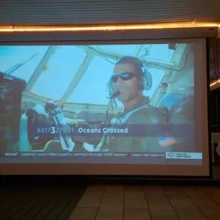 Huge, floor-to-ceiling screen.