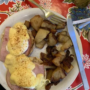 Eggs Benedict and hash browns.