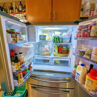 an open refrigerator in a kitchen