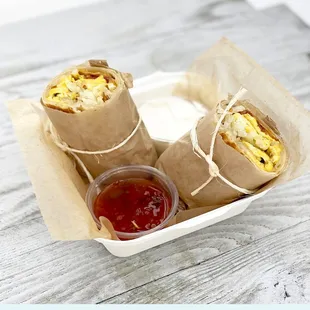 Breakfast burrito Pasture-raised Eggs, Mexican Blend Chz,  Smoked Bacon, Homemade Hash Browns on a Tortilla w/ a side of salsa, sour cream