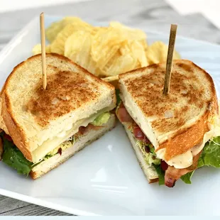 The Club 
Organic smoked turkey breast, Swiss cheese, lettuce, tomato alfalfa on sourdough bread. Served with chips. Add bacon or avocado