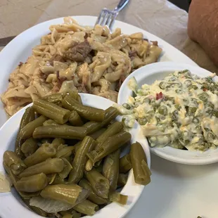 Beef noodles, green beans, pea salad