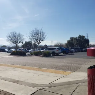 Handicap parking spots in front of entrance with a sidewalk ramp.